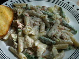 Salmon Penne With Basil Pesto Cream Sauce, Artichokes, and Asparagus. Photo by sweetcakes Salmon Penne With Basil Pesto Cream Sauce, Artichokes, and Asparagus. Photo by sweetcakes