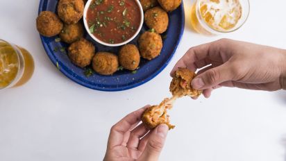 Mexican Rice Balls Leftover Rice Recipe Food Com Form the rice into small balls that fit into the palm of your hand and stuff a cube of cheese into the dip each rice ball first in flour, then in the egg, then in bread crumbs. mexican rice balls leftover rice