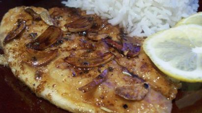 Sauted Fish Fillets With Sliced Garlic And Butter Sauce Recipe