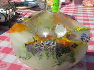 Frozen Festive Vodka or Tequila Bottles With Herbs and Berries