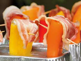 Mini Peppers Stuffed With Cheese and Topped With Bacon - Grilled