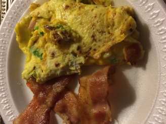 A Bacon Cheddar Western Omelette With Bacon on the Side