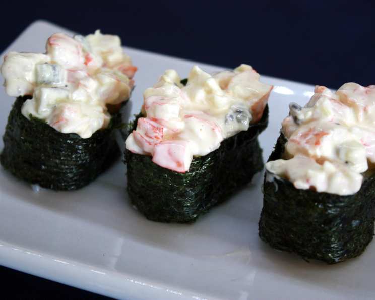 Gunkan Maki Sushi of fish salmon, scallop, perch, eel, shrimp and