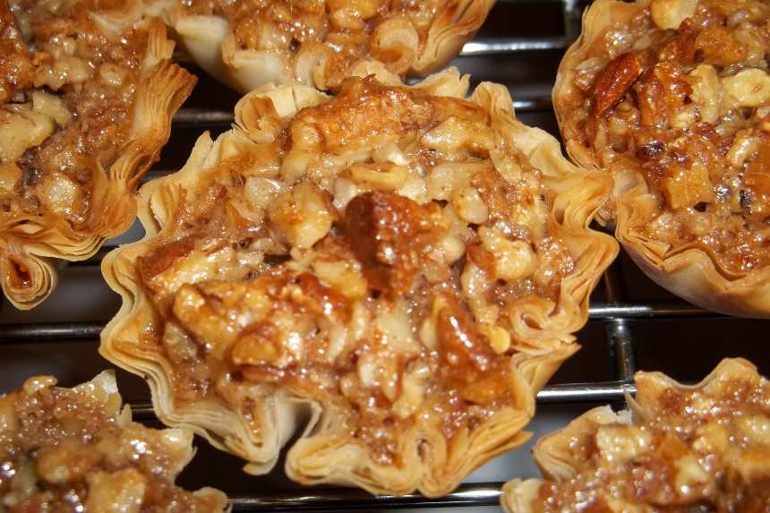 Phyllo pastry cups filled with traditional pecan pie. Take pecan