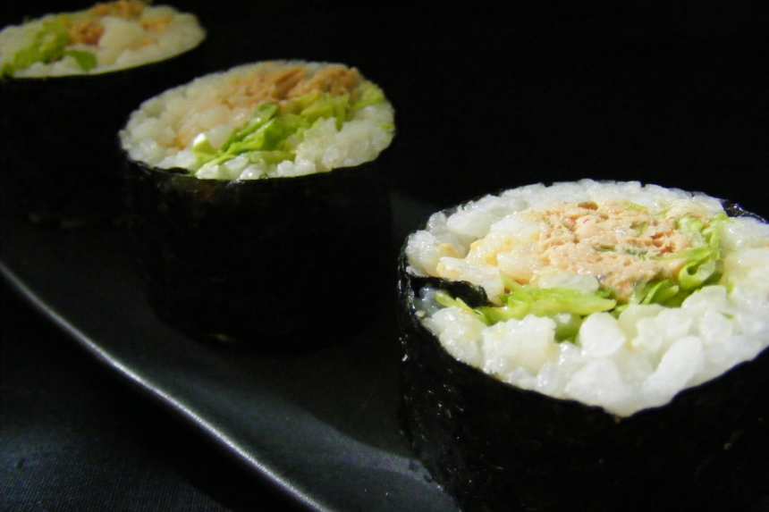 Sushi roll with smoked tuna with cucumber and - Stock Photo