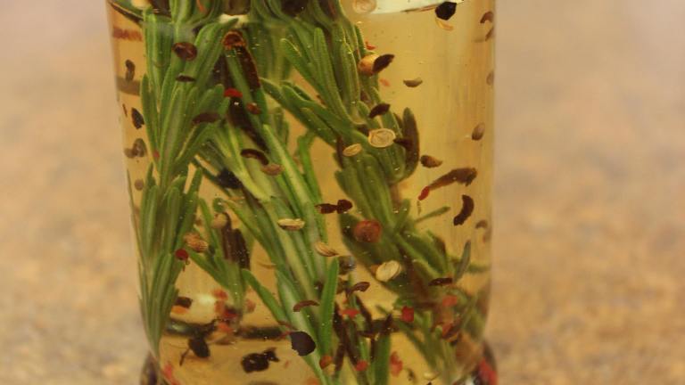 Olive Oil with Rosemary and Pink Peppercorns Created by Barenakedchef