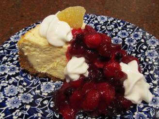 Festive Creamy Cheesecake With Tangy Cranberry Topping!