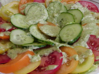 Tomato and Cucumber Salad With a Pesto Like Dressing.