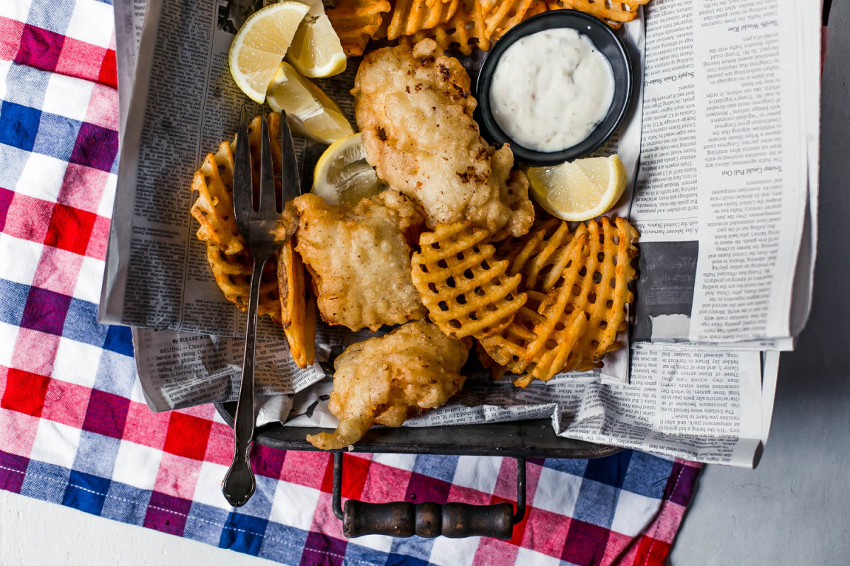 Traditional Homemade British Beer Battered Fish and Chips, with a classic  easy batter recipe