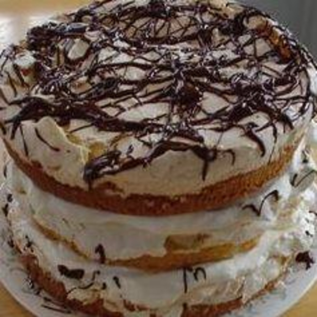 Almond Cake With Meringue and Whipped Cream Filling