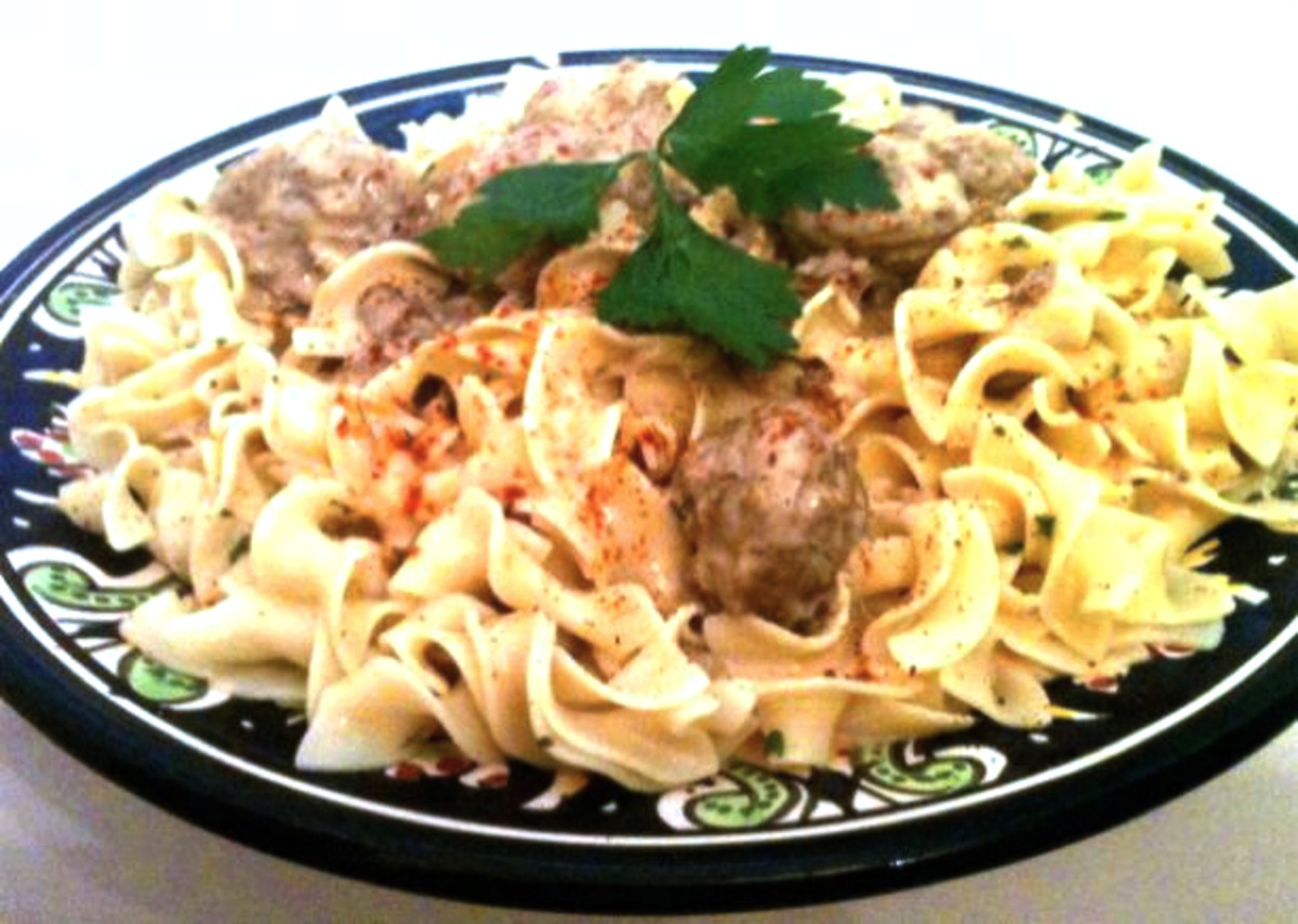 Swedish Meatballs in Sour Cream Sauce over Buttered Egg Noodles image
