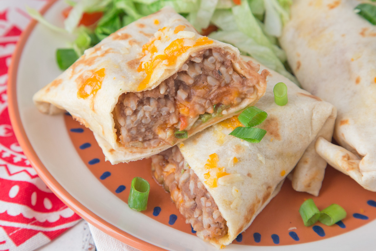 Deep-fried burrito with rice, beans, cheese, and meat.