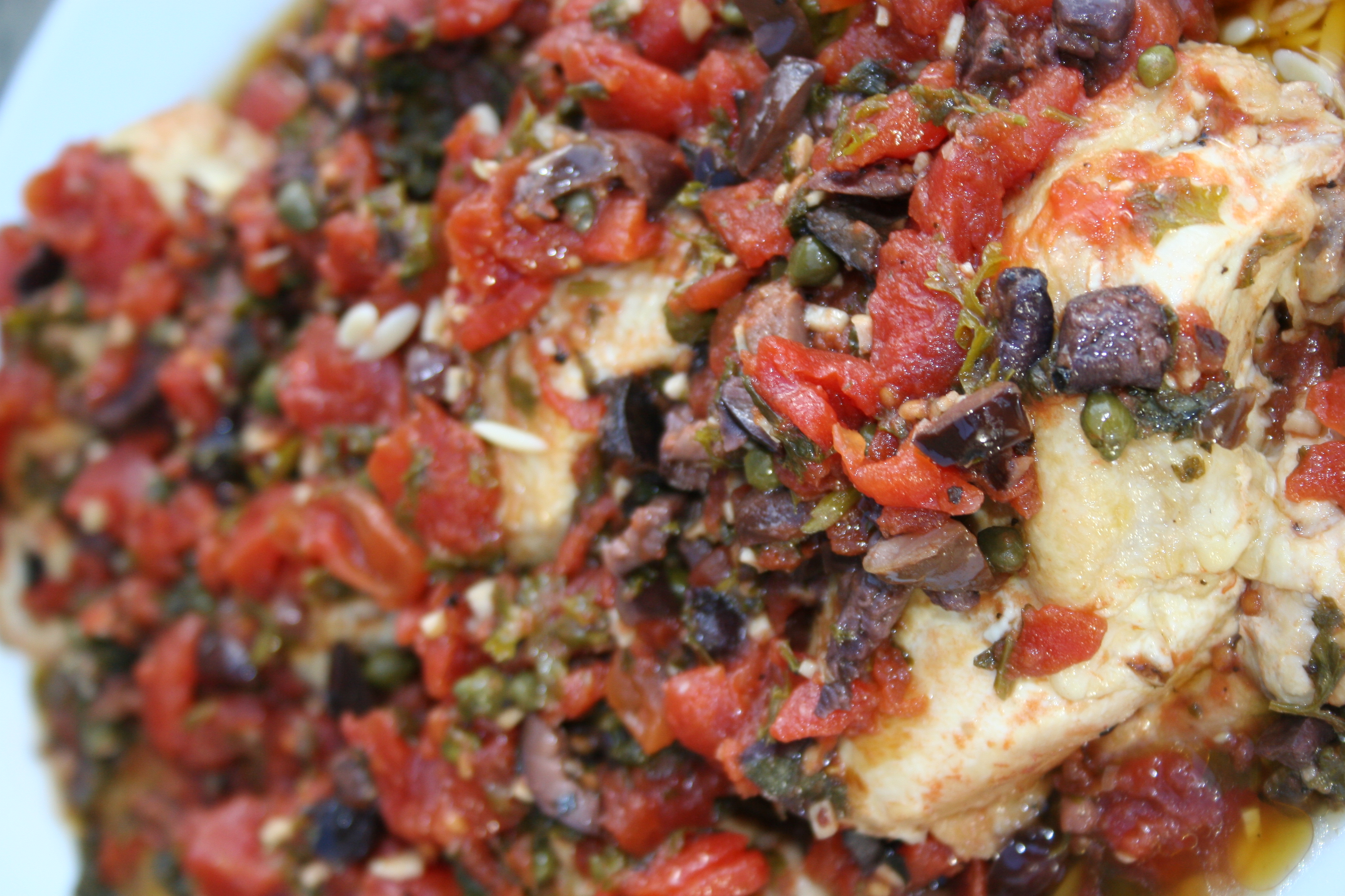 CHICKEN THIGHS WITH TOMATOES, OLIVES AND CAPERS