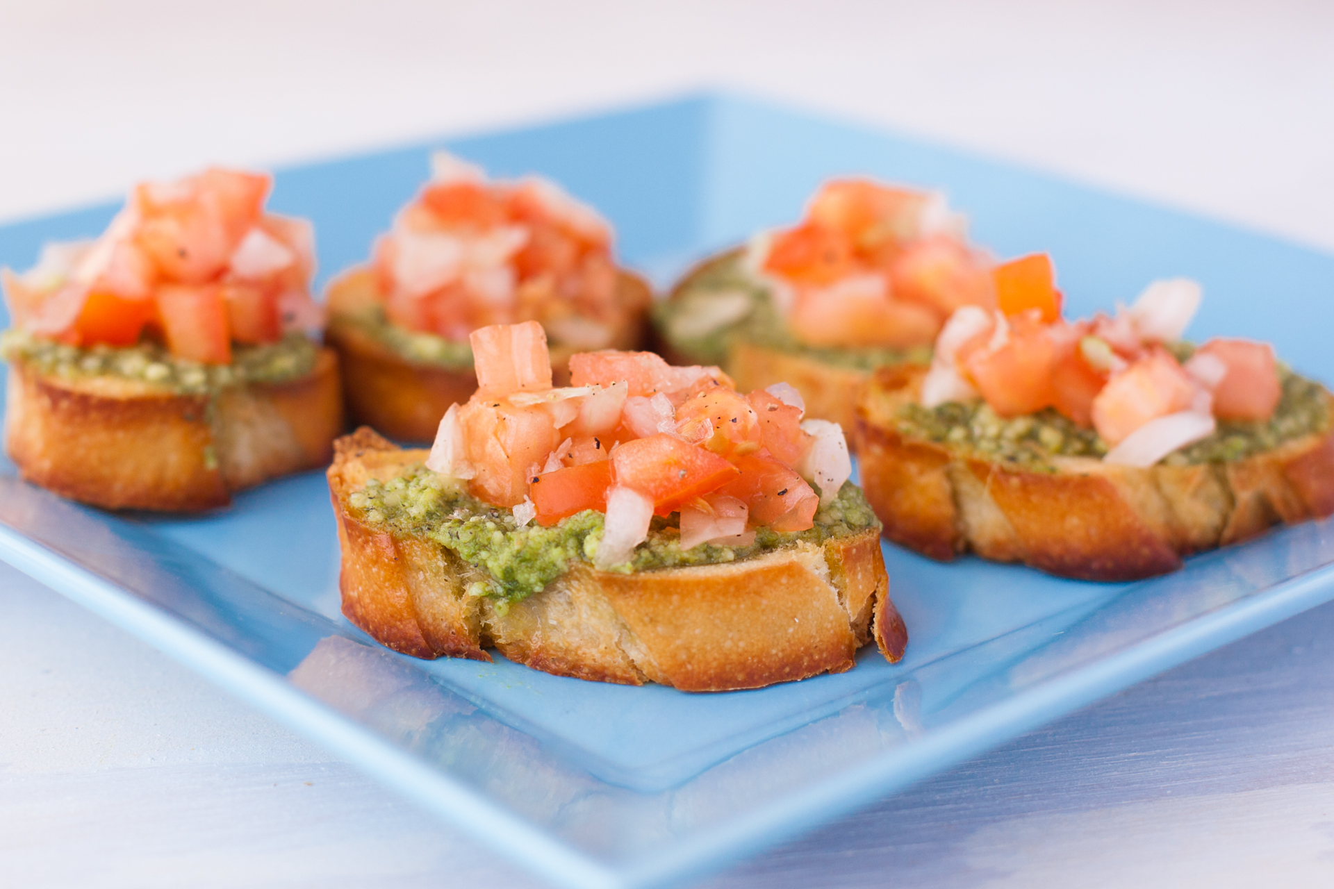 BRUSCHETTA WITH PESTO, TOMATOES AND THINGIES.