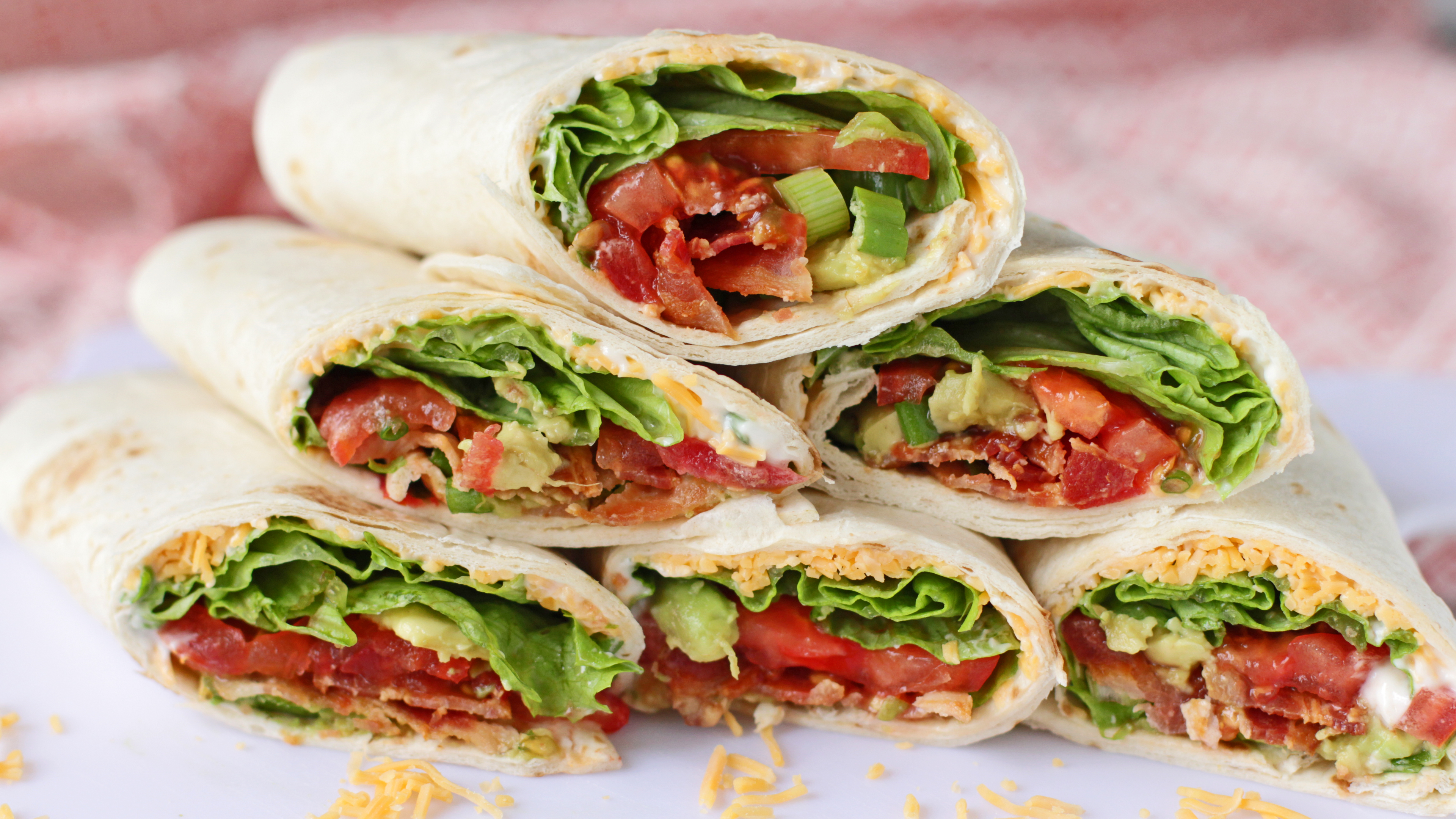 A FUN AND FROLIC KIND OF AVOCADO, BACON, AND TOMATO WRAP YIPPEE!