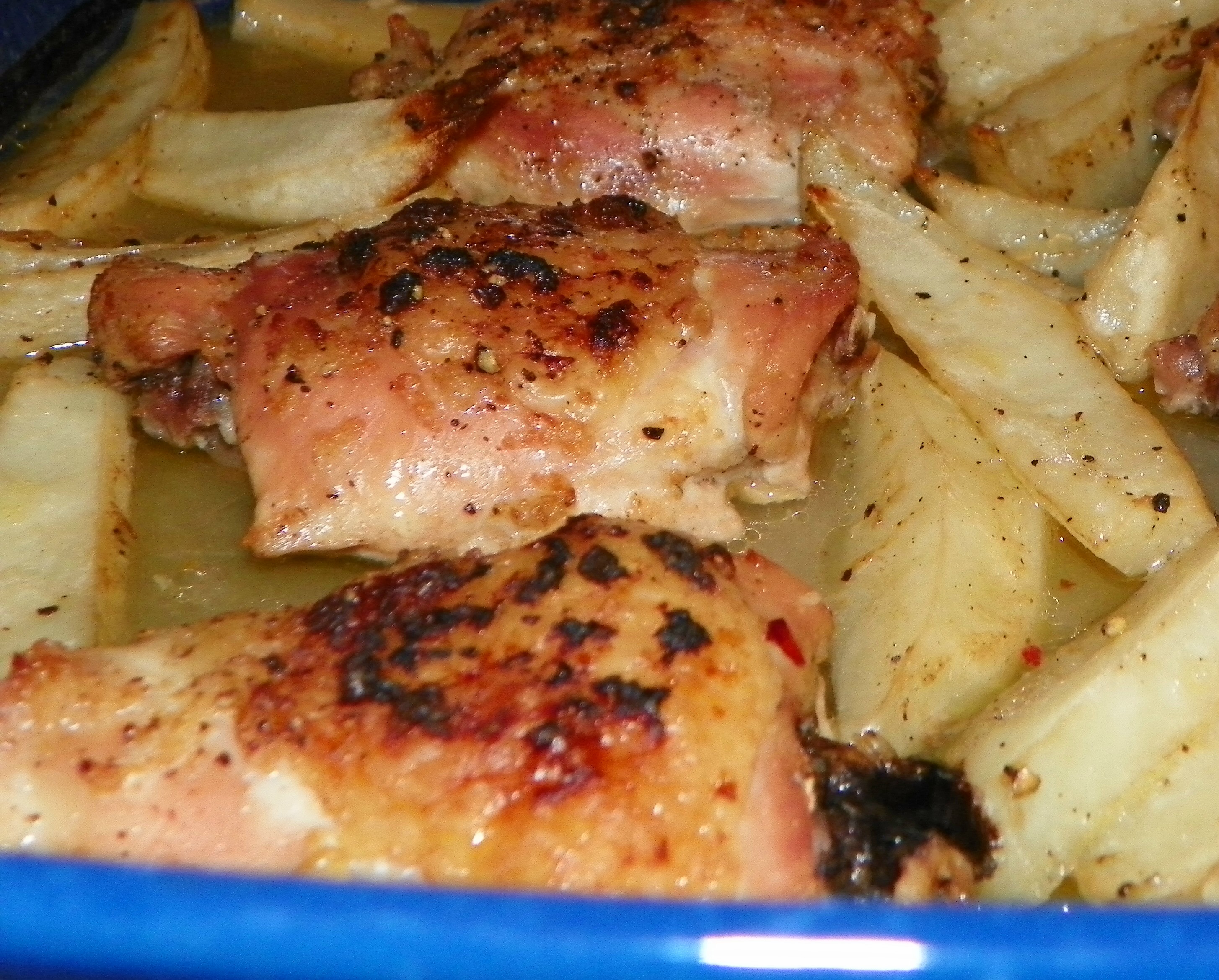 AMAZING BAKED LEMON GARLIC CHICKEN THIGHS AND POTATOES