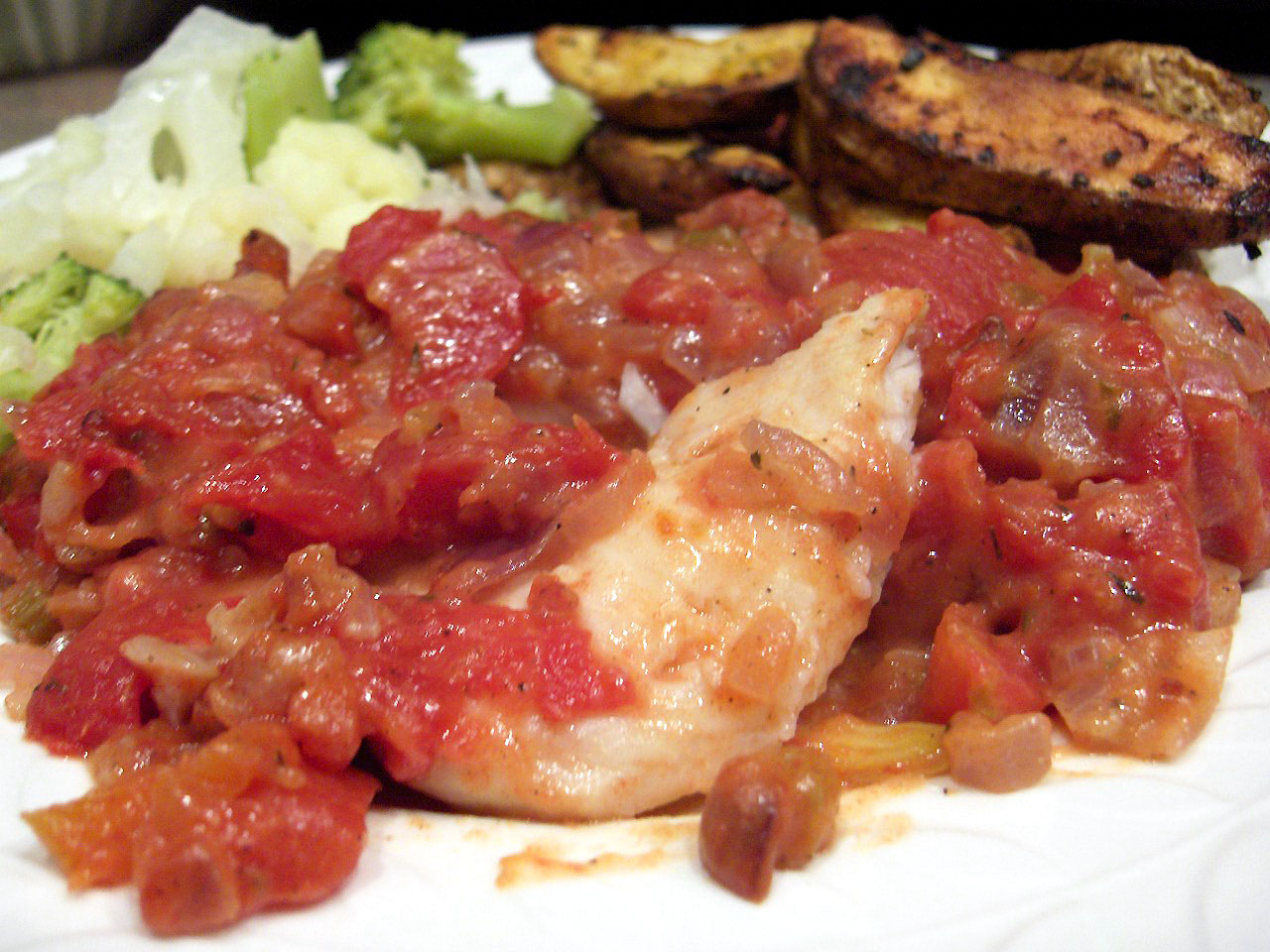 BAKED FISH WITH TOMATOES