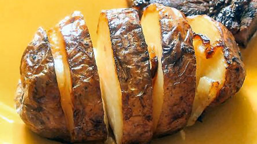 grilling baked potatoes in foil on gas grill